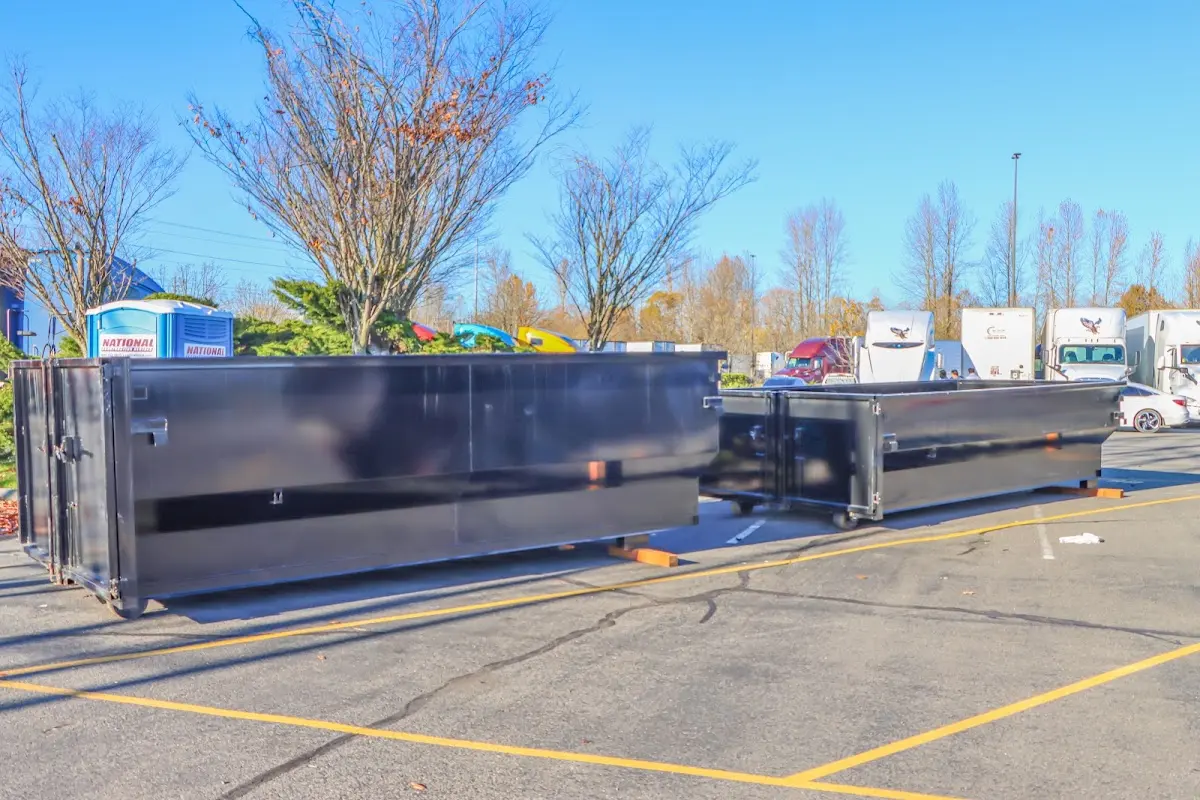 Professional dumpster rental service with roll-off container on residential driveway in Kendale Lakes